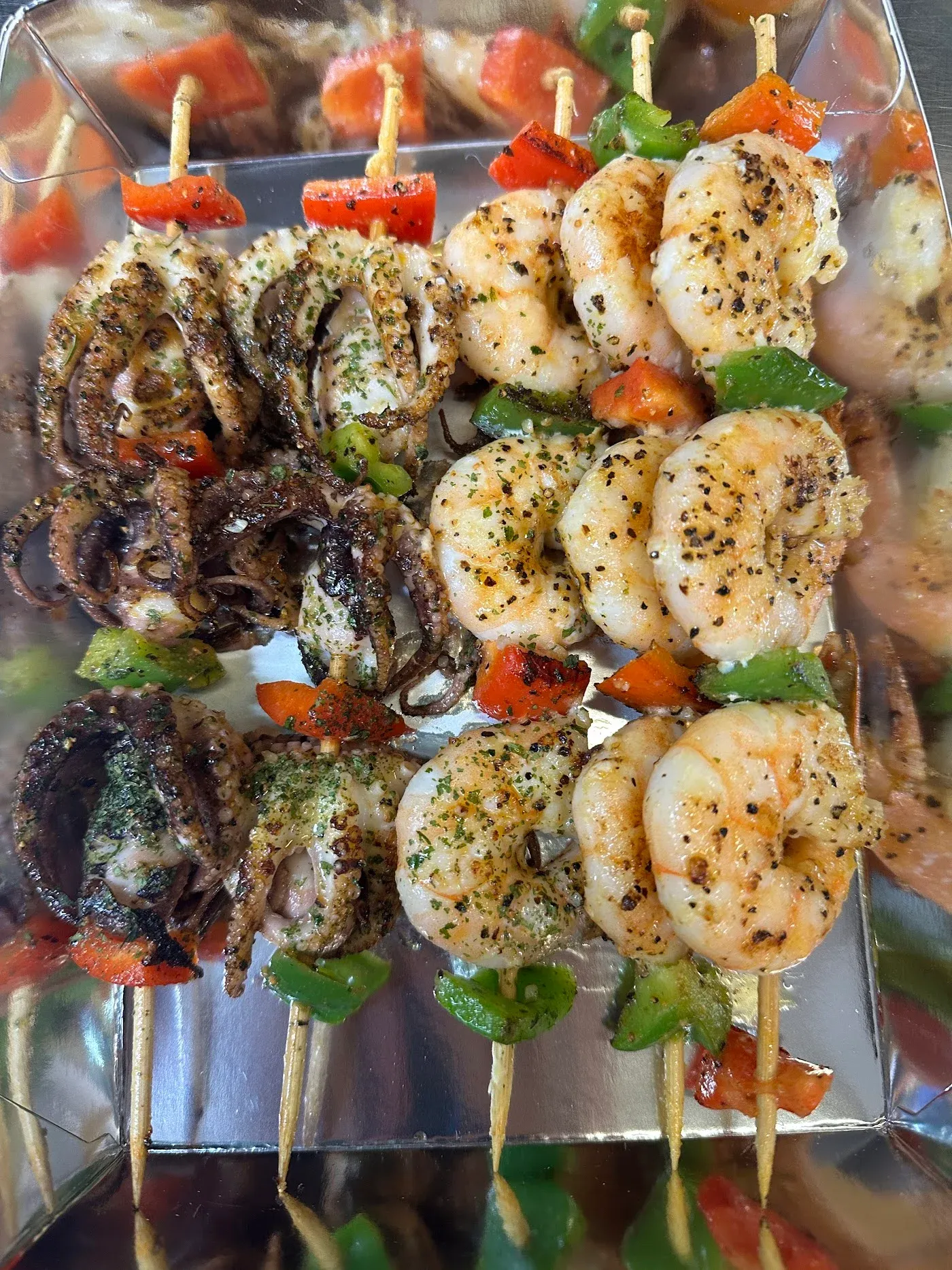 The Signature Platter - Grilled fish, prawns, and calamari